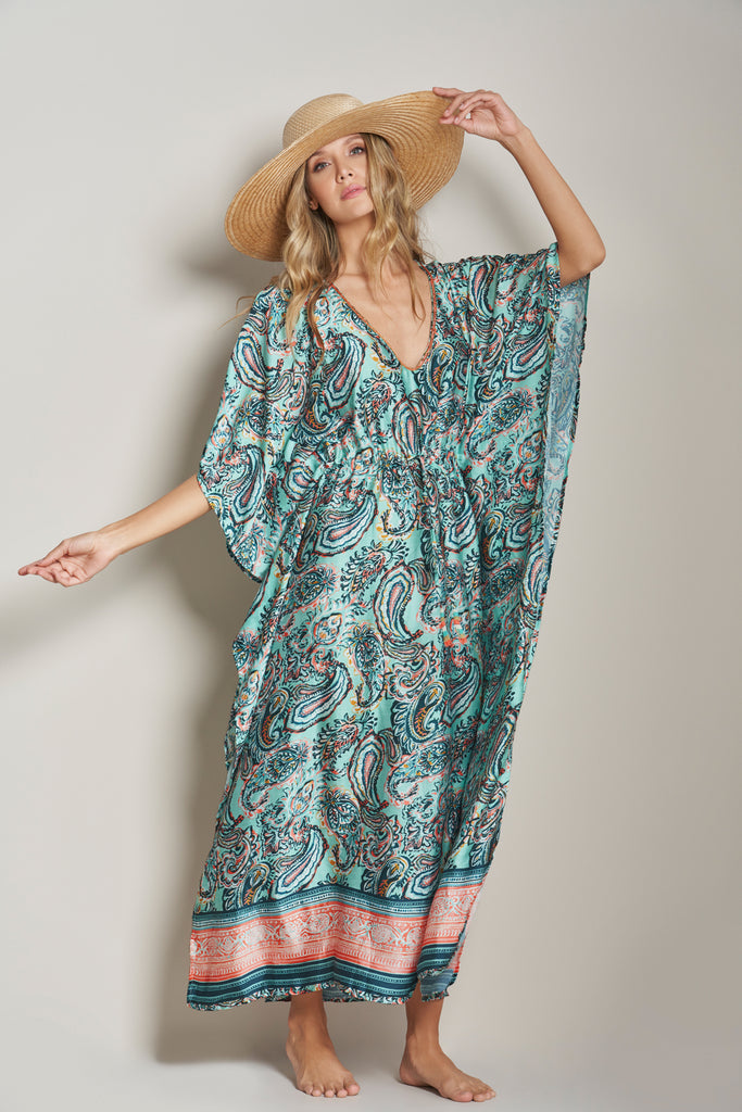 An elegant long caftan adorned with a graceful paisley print