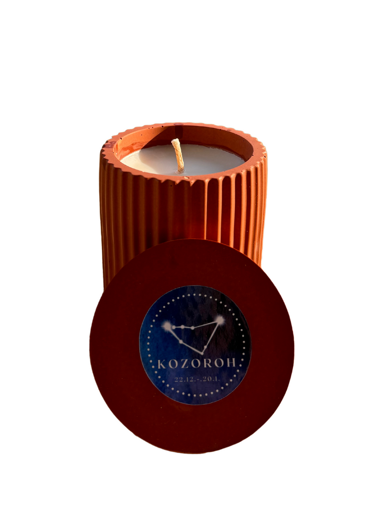 Handmande candle with the Capricorn zodiac sign, orange color, made from soy wax.