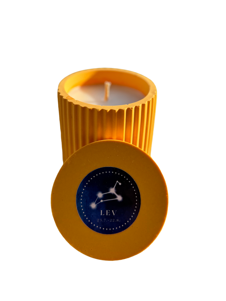 Handmade candle with the Leo zodiac sign, yellow color, made from soy wax.